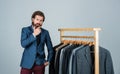 Man with suit. tailor in his workshop. Handsome bearded fashion man in classical costume suit. Man in custom tailored