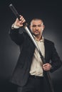 man in suit taking of his katana sword Royalty Free Stock Photo