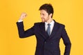A man in a suit with a tie Handsome looking face with beard In Mad Look, business people are happy by raising their hands to raise