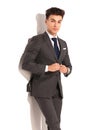 Man in suit and tie unbuttoning his coat Royalty Free Stock Photo