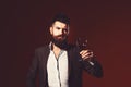 Man in suit toasting with sparkling glass of red wine Royalty Free Stock Photo