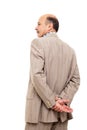 Man in the suit turned his back, taking thoughtfully his wrist Royalty Free Stock Photo