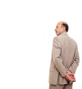 Man in the suit turned his back, taking thoughtfully his wrist Royalty Free Stock Photo