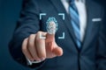 Man in suit uses fingerprint scan for secure access and identification technology authentication system Royalty Free Stock Photo