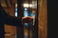 Man in a suit using a key card to access a secured door in a hotel corridor Royalty Free Stock Photo