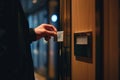 Man in a suit using a key card to access a secured door in a hotel corridor Royalty Free Stock Photo