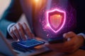 man in suit is using laptop and holding smartphone with digital shield symbolizing cybersecurity image conveys sense of