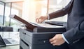 A Professional Businessman Operating a Printer