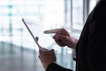 Man in a suit using tablet. Businessman with smart mobile device