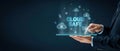 Man in suit using tablet with CLOUD SAFE text and lock icons, representing secure cloud computing and data protection Concept of Royalty Free Stock Photo