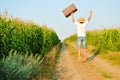 Man with a suitcase on a rural road in summer Royalty Free Stock Photo