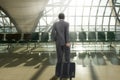 Man with suitcase in terminal airport Royalty Free Stock Photo