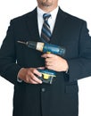 Businessman holding drill