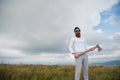 Man in sunglasses with axe stand on mountain landscape Royalty Free Stock Photo