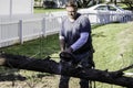 Man cutting tree with gas powered chainsaw Royalty Free Stock Photo