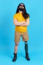 Man with sunglasses standing with a prosthetic leg Royalty Free Stock Photo