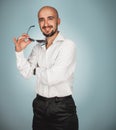 Man with sunglasses in studio smiling Royalty Free Stock Photo