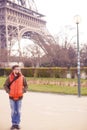 Man in sunglasses, tourist with video camera walks in spring Paris Royalty Free Stock Photo