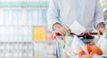 Man shopping with a grocery list Royalty Free Stock Photo