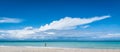 Man in the surf. Warm afternoon on the beach in Cuba. A man walks in the gentle ocean surf in Varadero. Royalty Free Stock Photo