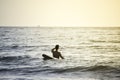 Man and surfboards in the evening sea at Koh Payamm, Thailand - Exercise is good for health