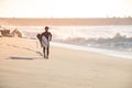 Man surfer run in the beach Royalty Free Stock Photo