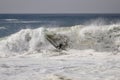 Surfer surfing a large wave at The Wedge in Newport Beach California