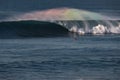 Perfect barrel wave with rainbow spray and surfer Royalty Free Stock Photo
