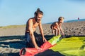 Man surfers with his son in wetsuits with kite equipment Royalty Free Stock Photo