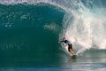 A Man Surfing a Blue Wave in Hawaii Royalty Free Stock Photo