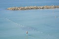 Man surfing on a SUP Standup paddleboarding in the water of the Mediterranean Sea
