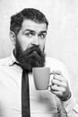 Man with surprised face drink tea from coffee cup Royalty Free Stock Photo