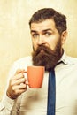 Man with surprised face drink tea from coffee cup Royalty Free Stock Photo