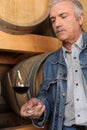 Man surrounded by barrels Royalty Free Stock Photo