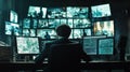 Man in surveillance room monitoring multiple security camera feeds on large screens in dark control center