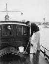 Man swabbing deck of boat Royalty Free Stock Photo