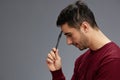 man in a sweater with pen posing emotions business and office concept