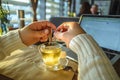 Man in sweater working on laptop in caffe on sunset Royalty Free Stock Photo