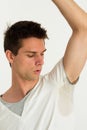 Man sweating very badly under armpit and looking t Royalty Free Stock Photo