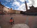 Man sweeping floor in square in Sienna