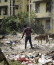 December, 2022, Raipur, India: Man sweeping the trash with broom , Man cleaning the polluted area, Pollution control day, Royalty Free Stock Photo