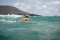 Man swim surf in the sea back view with blue sky Royalty Free Stock Photo