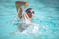 Man swimmer swimming crawl in a blue water pool Royalty Free Stock Photo