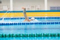 Man swimmer swimming crawl in blue water. Royalty Free Stock Photo