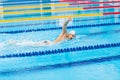 Man swimmer swimming crawl in blue water. Royalty Free Stock Photo