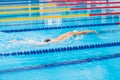 Man swimmer swimming crawl in blue water. Royalty Free Stock Photo