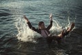 Man swimming with business suit