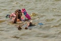 Man swimming with Ganesha idol