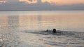 man swimming in the lake in the afternoon Royalty Free Stock Photo