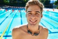 Man, swimming pool and portrait for sport with smile, workout and exercise for wellness, health and fitness. Swimmer Royalty Free Stock Photo